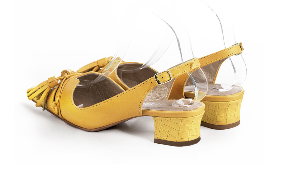 Mustard yellow women's open back shoes, with a knot. Tapered toe. Low kitten heels. Rear view - Florence KOOIJMAN